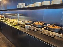 This shows only about 1/3 of the food offerings and none of the many drink offerings of the A3 lounge. Here on the right, the spanakopita, tiropita and bougatsa, which also offered powder sugar and cinnabon for those who wanted any (very thoughtful of them not to already have sprayed them with that).