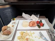 Salmon was uninspiring but acceptable. Larger portion than what I had on the ex-YUL flight last year but very comparable quality. Sides were fine. 

I was seated in 1A so entree came out quite quickly.