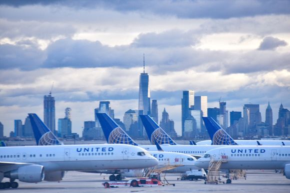 View of parked UA planes with NYC backdrop taken from Inside of plane at EWR