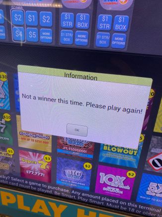 Alas, not a winner!   Am curious, though, what other airports have lotto machines in them?