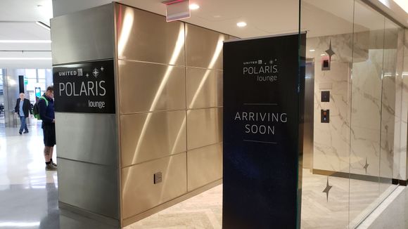 The entrance is next to Wolfgang Pucks. It's also next to gate 73.