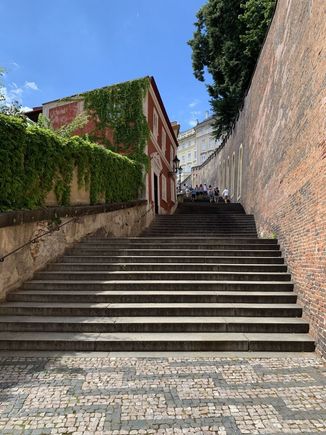 Up we go to the Prague Castle on an empty staircase.