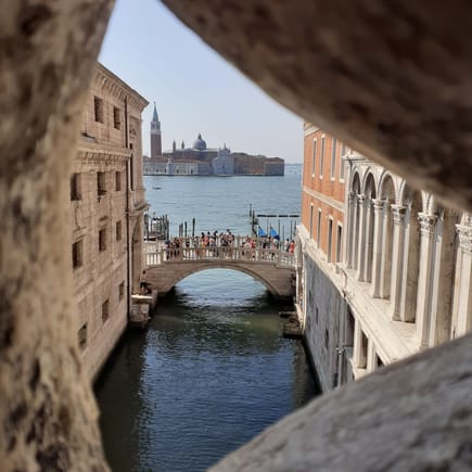 From inside the Bridge of Sighs coming back from the prison cells to the Palace and looking towards Riva degli Schiavoni 