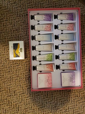 Here are my latest Secret Santa gifts. It's possible they are from two different Santa's-I don't know-there was no ID. One is a lovely hand mad bar scented with white tea and ginger and their other is 12 tubes of hand lotion in perfect traveling size in 6 different scents with 2 bars of soap. Big thanks for both-I love them both!! 
