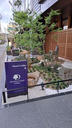 Entrance to the hotel from the street. Nice to see  some plants rather than a generic front door