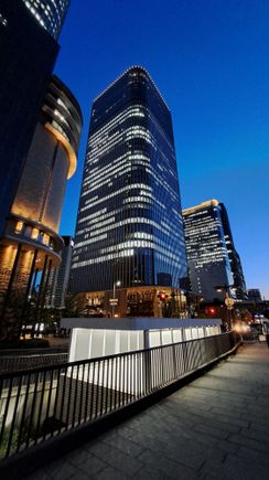 The Conrad osaka building at dusk twilight. My room is on the right . The hotel is the top floors ( darker colours as the offices are well lit). You go up to the lobby on the 40th floor then another elevator  down to your room ( 33 to 37 floors)