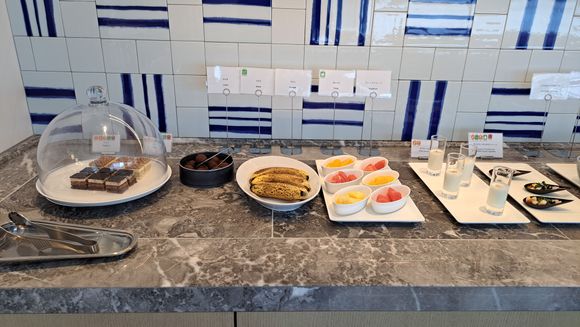 A selection of snack available in the afternoon ( other days had smoked salmon, roast duck and roast pork  in the small containers). Some savoury snacks in jars and yoghurt in fridge. Pretty impressive for a hilton and made a change from scones at the Conrads