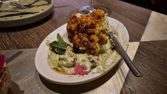 Golden spiced cauliflower with zhoug labneh, zhoug salsa and pickled onion 