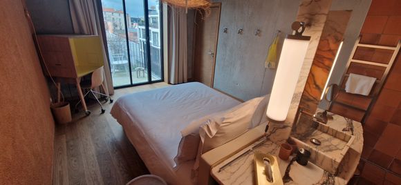 bed in the centre of room