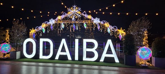 Odaiba decorations with the year round christmas tree, the  rainbow bridge and tokyo tower in the background