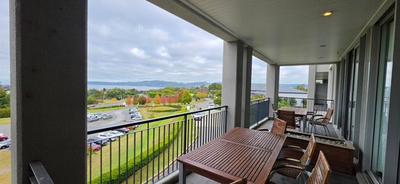 Balcony with a lake view, the best thing about the room really