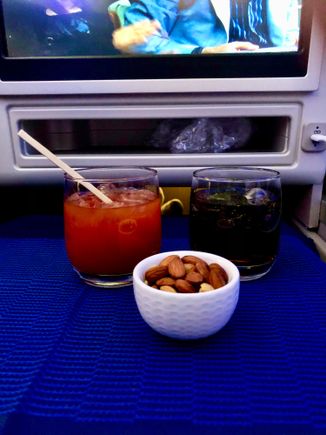 Bloody Mary and Coke with warm nuts.