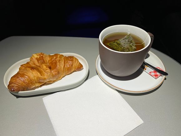 Warm croissant and tea