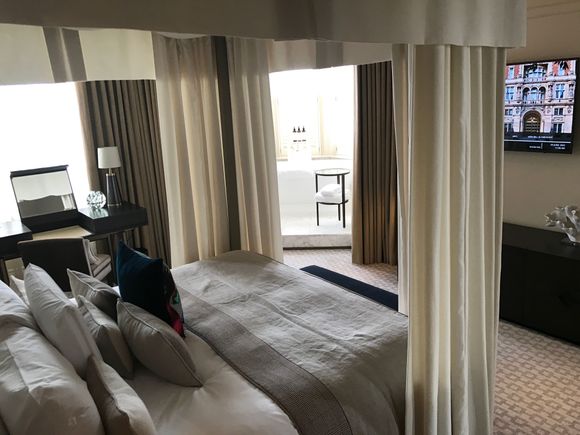 Large bathtub in bedroom corner with parkview