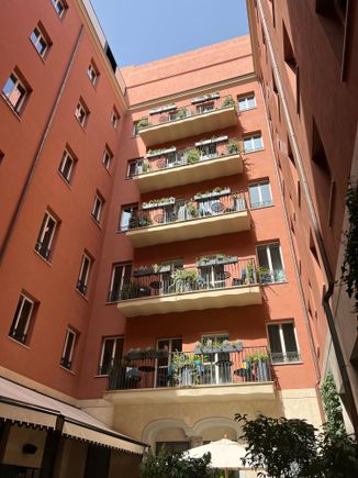 Courtyard view of rooms with a balcony