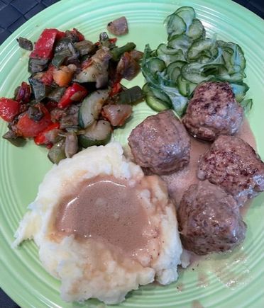 Marcus Samuelsson’s Swedish meatballs, sauce and pickled cucumbers recipes with mashed potatoes and mixed vegetables. 