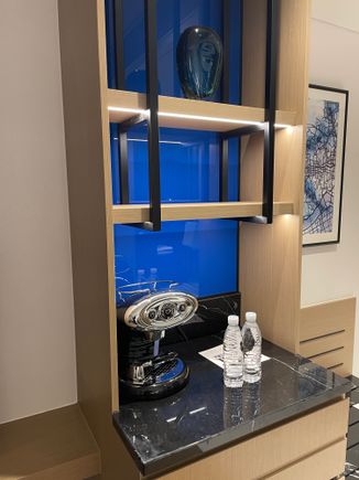 Mini Fridge with Coffee/Espresso machine and a tea kettle in the drawers. 