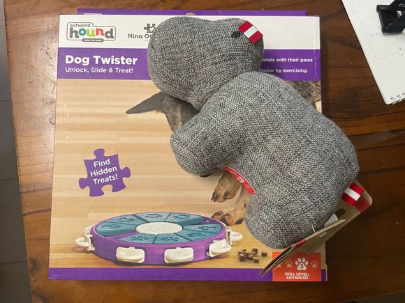 Unsure if these are here or Santa paws (!), a doggy puzzle feeder and European looking cuddly toy 