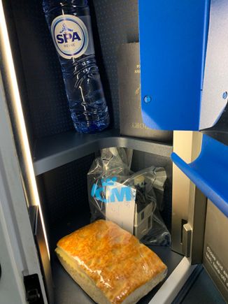 At seat when boarding: ham and cheese sandwich and water bottle...