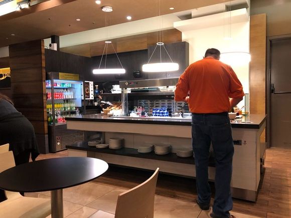 Food service area, bottled drinks at your left 