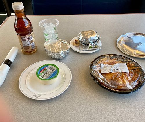 I ordered the Vegan Enchiladas, served with salad, a roll, a pudding cup, and an iced tea. The rice was chipotle chili flavored, Southwest vs California flavors. 