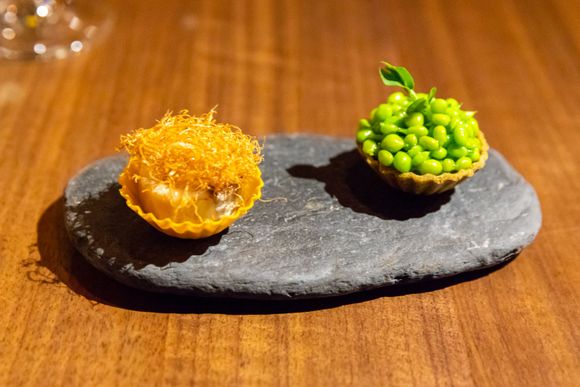 Amuse bouche: On the right, a cheese cream, peas, and pastry shell. On the left, a konbun kelp pastry shell with fish cream and mushroom. 