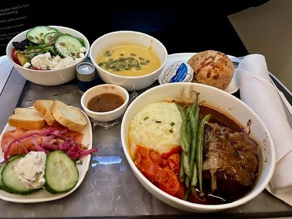 ATL - SCL: Single course likely due to a 90 minute delay due to luggage and passengers that were offloaded. The salmon and cream cheese that should have been the appetizer was the best part of this meal. The short rib was just kind of meh.