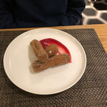 Cinnamon churros with chocolate cream and blood orange gel