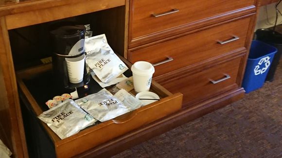 Starbuck coffee and paper/plastic cups. 