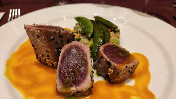 Sesame crusted tuna (prepared medium rare; quinoa & vegetable cake, baby bok choy, red pepper & miso sauce)