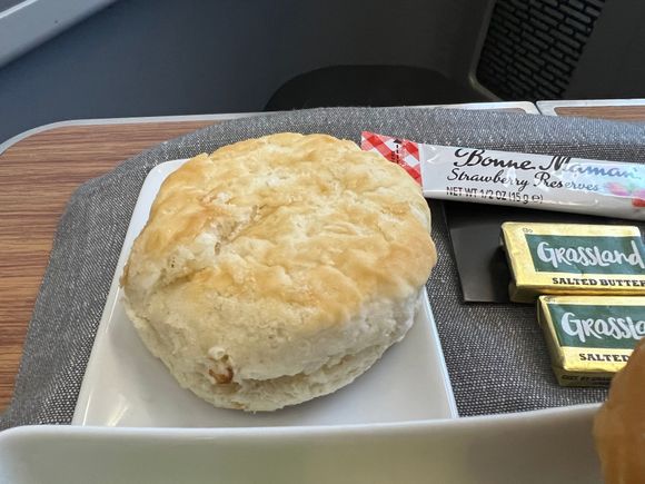 Warm biscuit from the basket.  Delicious with butter and the strawberry jam!