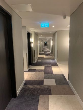 Corridor - new carpet smell and brown