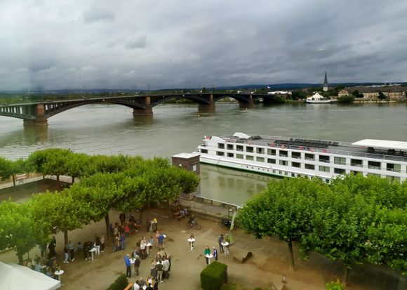 View out of the window overlooking the Rhine, with some sort of wine drinking thing in the back courtyard 