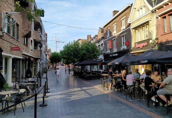 The main street in Genk, full of cafés and restaurants 