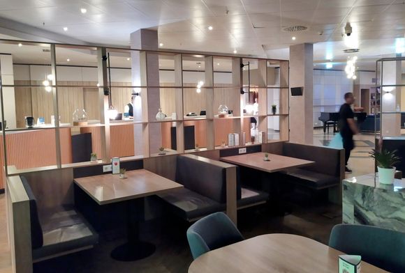 Rather pleasant bar area in the Crowne Plaza with reception in the background 
