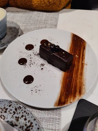 Very good chocolate expresso cake, note the edible golden pieces on top