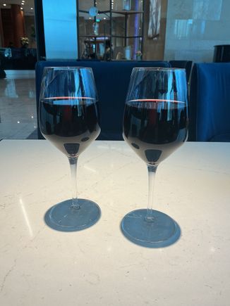 We chose a couple of glasses of house red.
