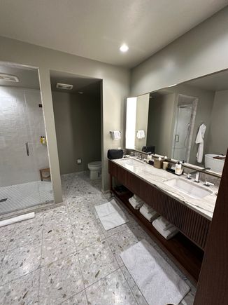 Bathroom angle 1. Spacious though some details missed, such as lack of a movable mirror.