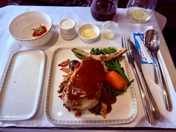 Veal Cutlet EWR-SIN: I love that it was served bone in. A bit overcooked but flavor was great and enhanced by the lardon (ie bits of bacon). Definitely not a healthy choice, and will probably enrage any readers that are members of PETA, but overall quite good and surprised it came out of an EWR catering facility