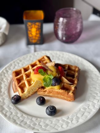 Breakfast Mains - Coconut waffles with mango curd maple syrup and fresh berries - this was excellent but the exact same dish as my flight 6 months prior.