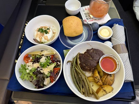 Flat iron steak/potatoes/asparagus, salad, burrata appetizer, and roll.