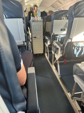 Yes a 50 minute flight comes with complimentary beverages, beer, wine and soft drinks