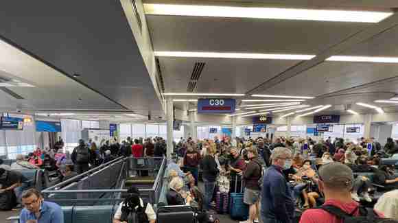 I had just arrived on a 319 from IAD and ran this scrum from the gate exit into the less occupied terminal area.   
