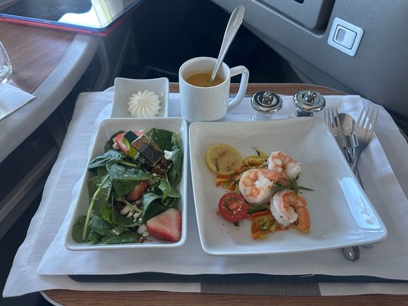 Appetizer. Soup was placed into a cup. Fine with me (I do this at the AC) and sped up service. 
