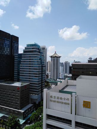 JW Marriott Tang  Plaza ( tiled roof) from the Hilton pool deck