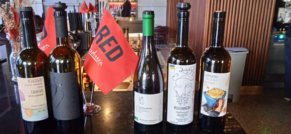the 5 wines tasted, where bartender busy , knew i understood Georgia, motioned to self -pour the glasses