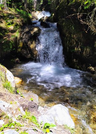 Occasionally the watercourse (bisse) plunges down a small waterfall 