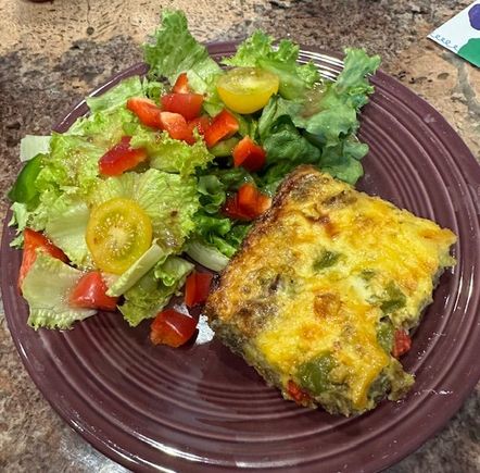 Leftover breakfast casserole and a salad. 