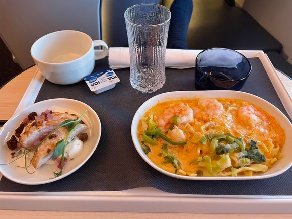 The shrimp tagliatelle. Very saucy (which I like) but quite ok for a seafood plane meal.
Dessert was a bun filled with vanilla cream