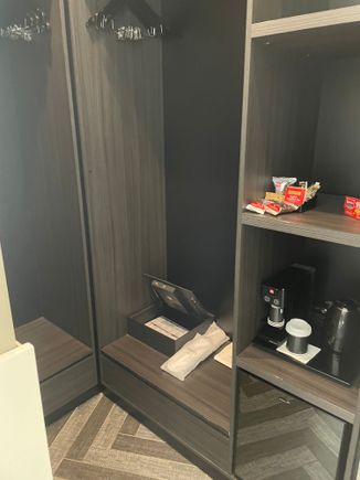 Walk in wardrobe and mini bar (behind bed)